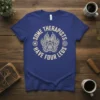 Some Therapists Have Four Legs quote on a blue t-shirt with a decorative paw print graphic