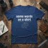 Navy blue t-shirt with "some words on a shirt" in white text and gear graphics