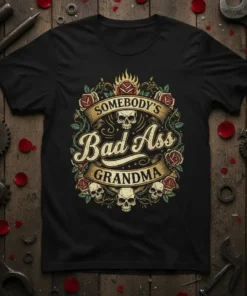 Black t-shirt with "SOMEBODY'S Bad Ass GRANDMA" in vintage style typography, surrounded by roses and skulls