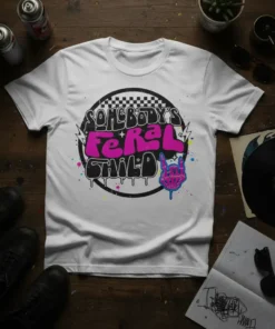 Somebody's Feral Child graffiti-style text with rock hand symbol on a white t-shirt