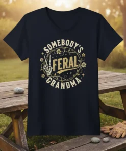 Somebody's Feral Grandma t-shirt design with golden distressed typography and skeleton hand giving peace sign