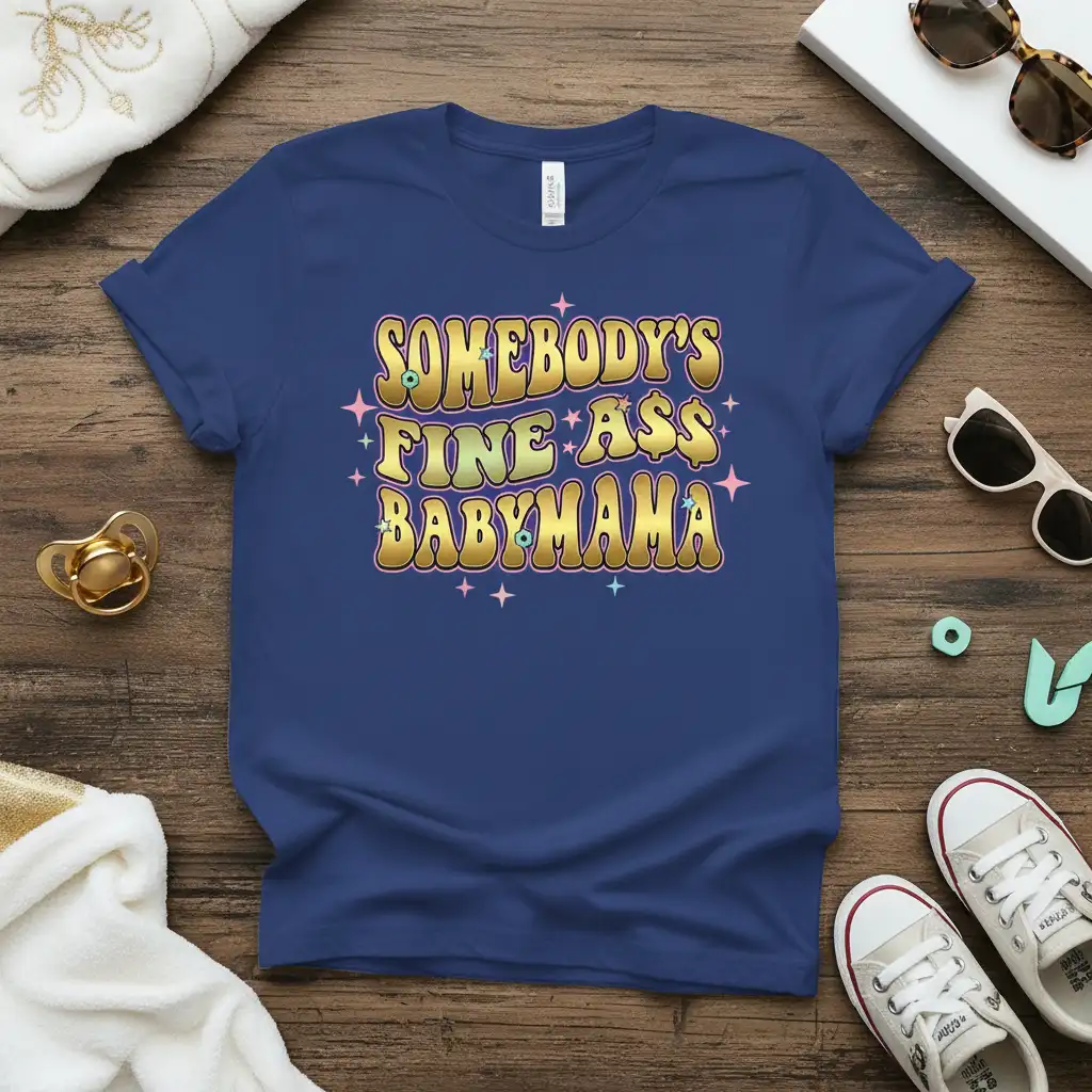 Somebody's Fine Ass Babyma$ quote in retro wavy gold and green font with star accents on a navy t-shirt