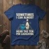 Sometimes I Can Almost Hear The Ten Pin Laughing quote on a blue t-shirt with a cartoon bowling ball and