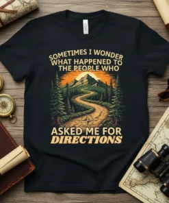 T-shirt with yellow text "Sometimes I Wonder What Happened To The People Who Asked Me For Directions" above a scenic