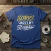 Sorry About My Husband funny quote t-shirt with gold and white lettering on a blue shirt