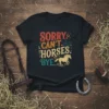 SORRY. CAN'T. HORSES. BYE. text with a running horse graphic on a black t-shirt