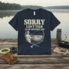 Sorry Can't Talk I'm On Another Line fishing t-shirt with graphic of a fisherman reeling in a fish