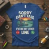 Sorry Can't Talk I'm On My Other Line fishing quote t-shirt with a man fishing at sunset