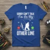 Sorry Can't Talk I'm On My Other Line fishing t-shirt design with a fisherman reeling in a fish