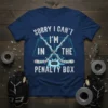 Sorry I Can't I'm In The Penalty Box hockey quote t-shirt with crossed sticks and puck graphic