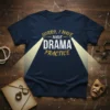 Navy t-shirt with white and gold text that reads "Sorry I Have Drama Practice," illuminated by spotlights