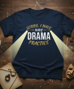 Navy t-shirt with white and gold text that reads "Sorry I Have Drama Practice," illuminated by spotlights