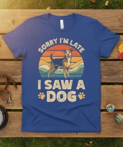 Sorry I'm Late I Saw A Dog text with a retro sunset and dog graphic on a blue t-shirt