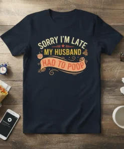Funny "Sorry I'm Late My Husband Had To Poop" quote t-shirt design in yellow and orange text on a navy