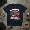 Navy t-shirt with "SORRY I'M ON'T ON CALL" text and vintage tow truck graphic