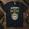 Sorry This Beard Is text with a detailed beard graphic on a navy t-shirt