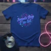 Sounds Gay I'm in! text in a vibrant neon style on a blue t-shirt, with geometric shapes and stars