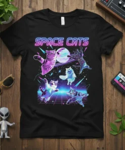 Black t-shirt with "SPACE CATS" in neon font and illustrated cats floating in space with planets and stars