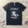 Sparkle unicorn t-shirt with flowing mane and tail, surrounded by stars and moons, on a navy blue shirt
