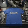Blue t-shirt with the word "Speedy" in a stylized, metallic font with motion blur effect