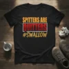Black t-shirt with bold yellow and red text reading "SPITTERS ARE QUITTERS #SWALLOW" in a striking font