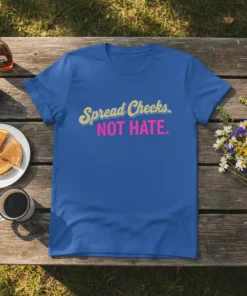 Spread Cheeks. NOT HATE. text design on a royal blue t-shirt, featuring cream and pink typography