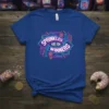 Blue t-shirt with the quote "Sprinkles Are For Winners" in neon pink and blue text with geometric accents