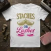 Staches or Lashes text with mustache and eyelashes graphic on a white t-shirt, gold and pink glitter design