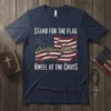 T-shirt with "Stand for the Flag, God Bless America, Kneel at the Cross" text and American flag graphic