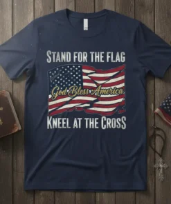 T-shirt with "Stand for the Flag, God Bless America, Kneel at the Cross" text and American flag graphic
