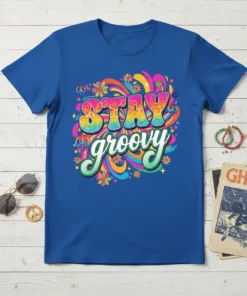 Blue t-shirt with "STAY groovy" text in colorful psychedelic font, surrounded by flowers and peace signs