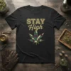 STAY High t-shirt with a green and purple plaid cannabis leaf graphic and distressed gold lettering