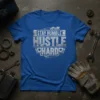 Stay Humble Hustle Hard quote on a blue t-shirt, featuring industrial gears and piston graphics, motivational apparel