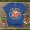 Blue t-shirt with "STAY SWEET FRUIT OF THE SPIRIT" text and a graphic of strawberries, listing virtues like love, joy