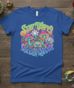 Stay Trippy Little Hippie text with colorful mushrooms and lotus flowers on a blue t-shirt design