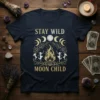 Stay Wild Moon Child t-shirt design featuring a bonfire, dancing figures, moon phases, and celestial elements