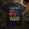 Stealing Hearts And Blasting Farts graphic t-shirt with a T-Rex skeleton holding a heart and emitting cartoon farts