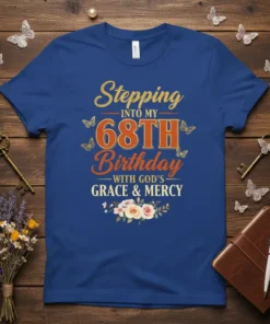 Stepping into my 68th Birthday with God's Grace & Mercy text and floral graphic on a blue t-shirt