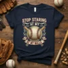 Funny baseball t-shirt design with text "STOP STARING AT MY AT MY BALLS" and a baseball graphic with bats