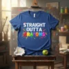 Straight Outta Crayons text design with colorful dripping crayons and artistic elements on a blue t-shirt