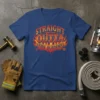 Straight Outta Fire Academy text with flames graphic on a navy blue t-shirt, featuring firefighter-themed elements