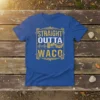Straight Outta Waco text graphic on a royal blue t-shirt, featuring city landmarks and vintage distressed font