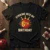 Striking Into My 6th Birthday text with bowling ball and pins graphic on a black t-shirt