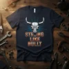Strong Like Bullt text with a metallic bull skull graphic on a navy t-shirt, symbolizing strength and power