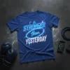Stronger Than Yesterday quote on a blue t-shirt with neon blue graphic elements and a boxing glove and jump rope