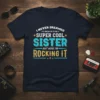 Navy blue t-shirt with "I Never Dreamed I'd Grow Up To Be A Super Cool Sister But Here I'm Rocking