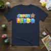 Super Kiddo text design in bold, colorful letters with a star graphic, printed on a navy blue t-shirt