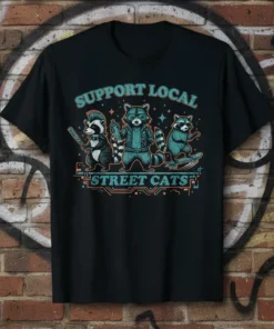 Support Local Street Cats t-shirt design with three anthropomorphic raccoons in urban attire, one with a mohawk and bat, one