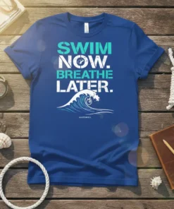 Swim Now Breathe Later T-Shirt with a large ocean wave graphic and text in blue and white