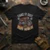 Motorcycle t-shirt design with text "TAKE IT OUT AND PLAY WITH IT" above a vintage motorcycle and flames